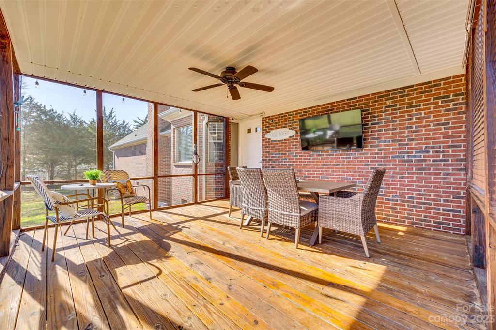 339 Gold Hill Road Fort Mill, SC 29715 - Photo 39 of 48 a view of a dining room with furniture large windows and wooden floor