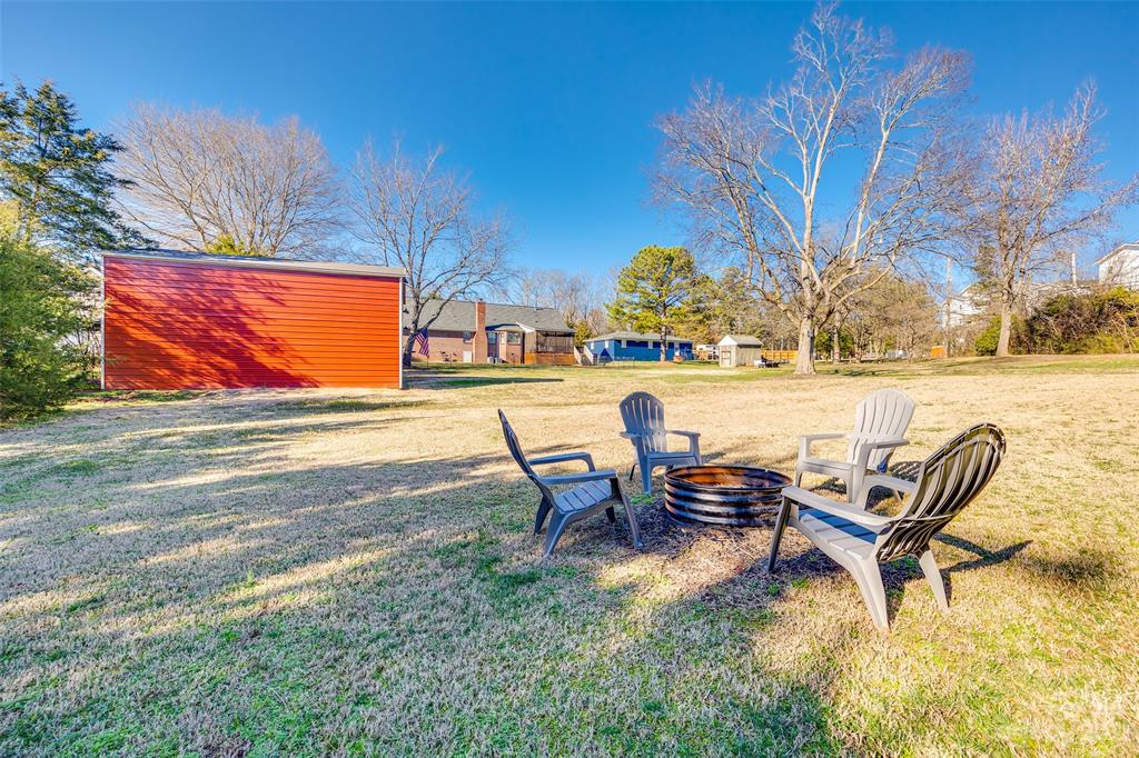 339 Gold Hill Road Fort Mill, SC 29715 - Photo 42 of 48 a backyard of a house with table and chairs
