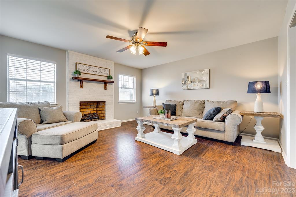 339 Gold Hill Road Fort Mill, SC 29715 - Photo 6 of 48 a living room with furniture and a fireplace