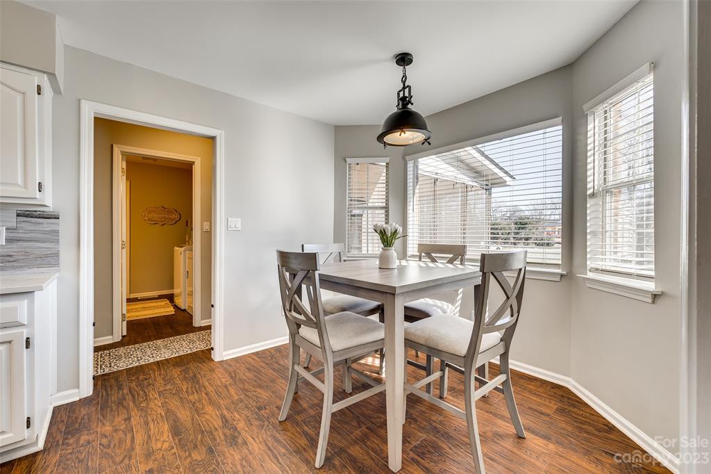 339 Gold Hill Road Fort Mill, SC 29715 - Photo 8 of 48 a view of a dining room with furniture window and wooden floor