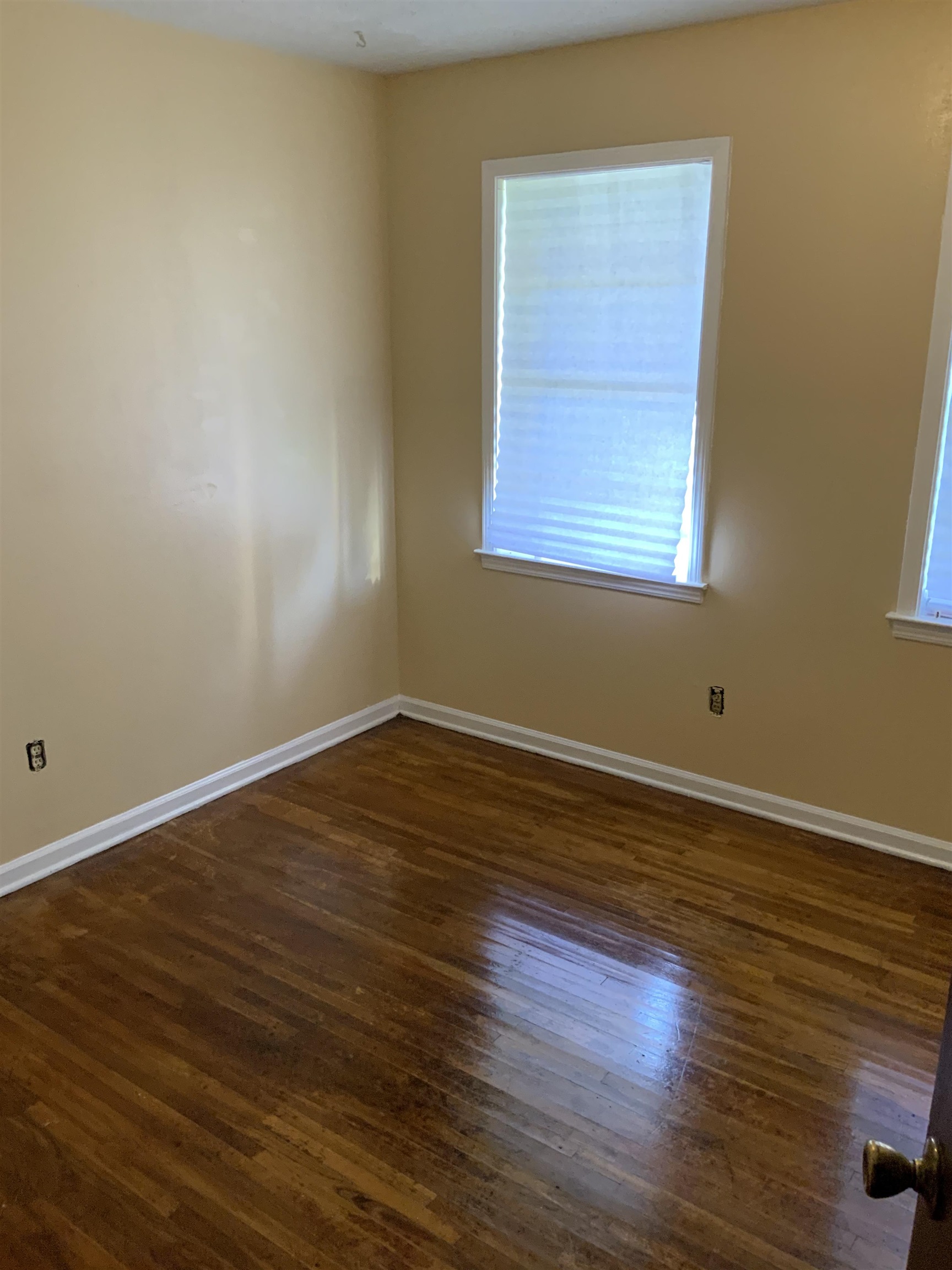 2854 Knightway Road Memphis, TN 38118 - Photo 12 of 16 a view of a room with wooden floor and windows