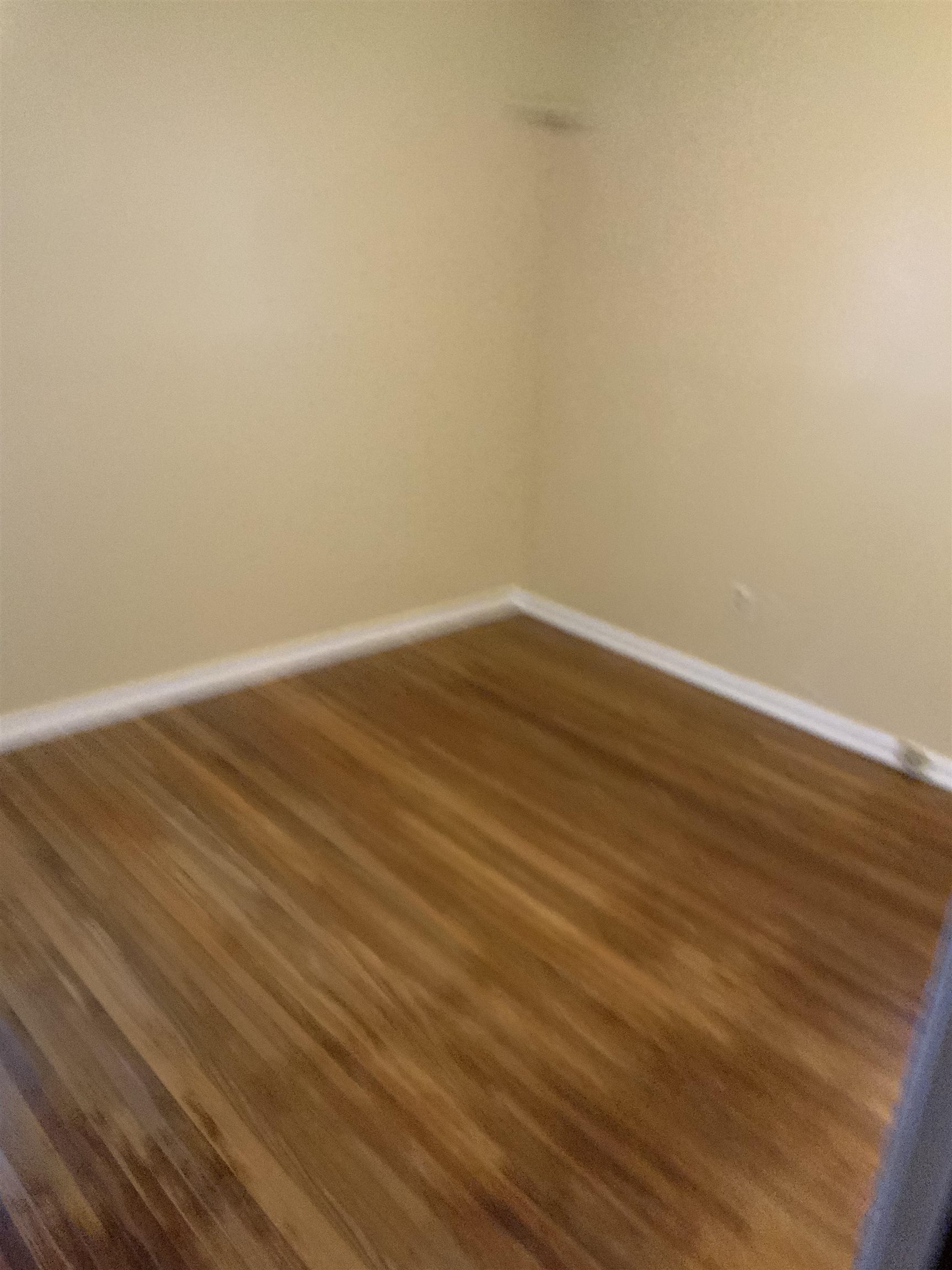 2854 Knightway Road Memphis, TN 38118 - Photo 14 of 16 a view of an empty room with wooden floor