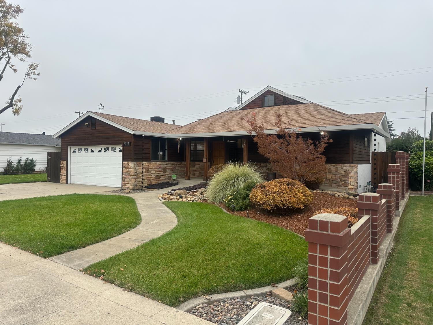 a front view of a house with garden