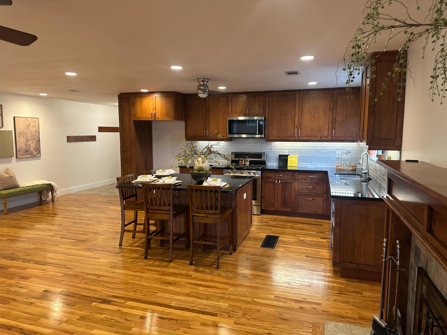 2013 Jerry Lane Lodi, CA 95242 - Photo 19 of 52 a kitchen with stainless steel appliances kitchen island granite countertop a sink a stove a dining table and chairs