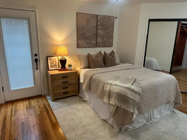 a bedroom with a bed and a window