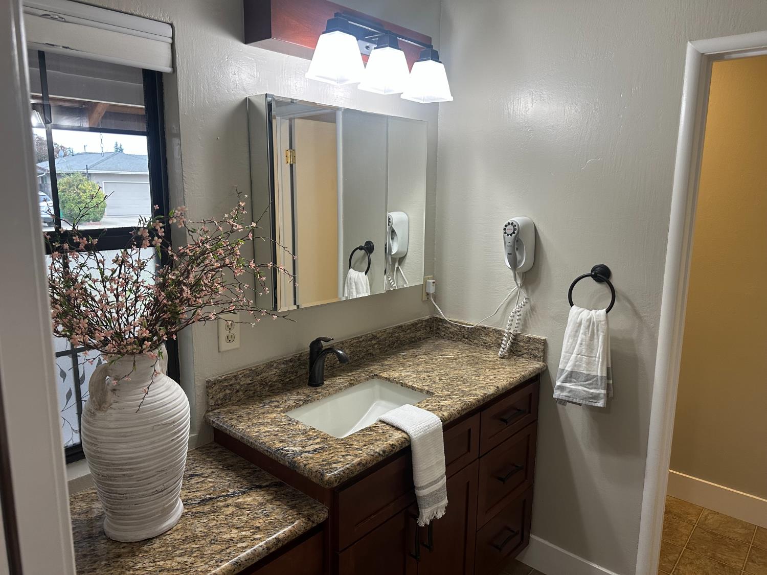 2013 Jerry Lane Lodi, CA 95242 - Photo 34 of 52 a bathroom with a granite countertop sink and a mirror