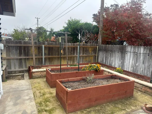 a view of a backyard with sitting area