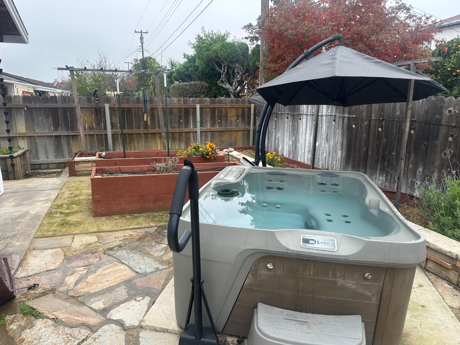 2013 Jerry Lane Lodi, CA 95242 - Photo 46 of 52 a view of a back yard with a wooden fence and a fire pit