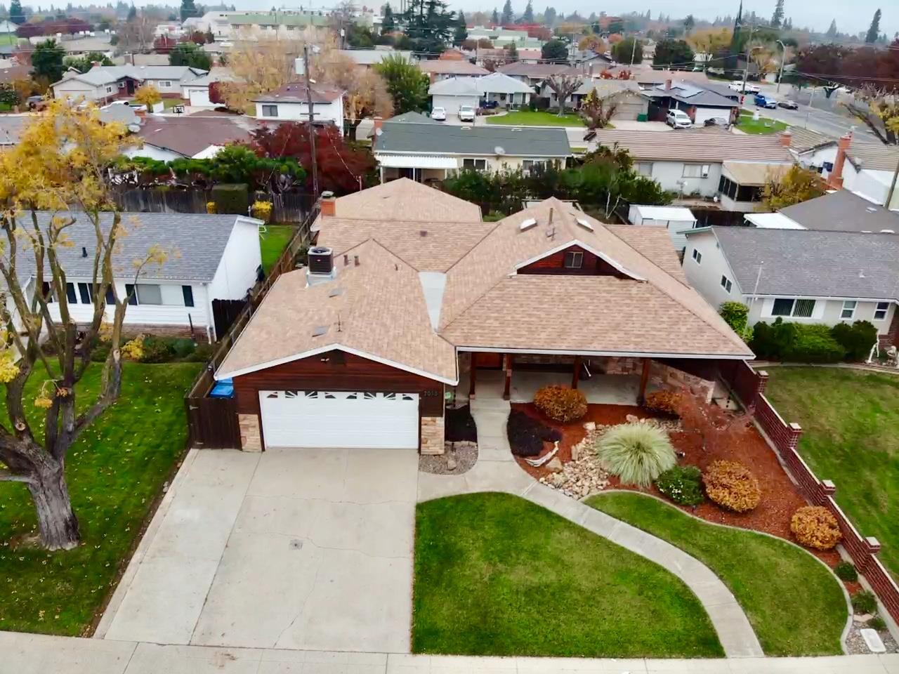 2013 Jerry Lane Lodi, CA 95242 - Photo 52 of 52 an aerial view of a house with a garden and trees