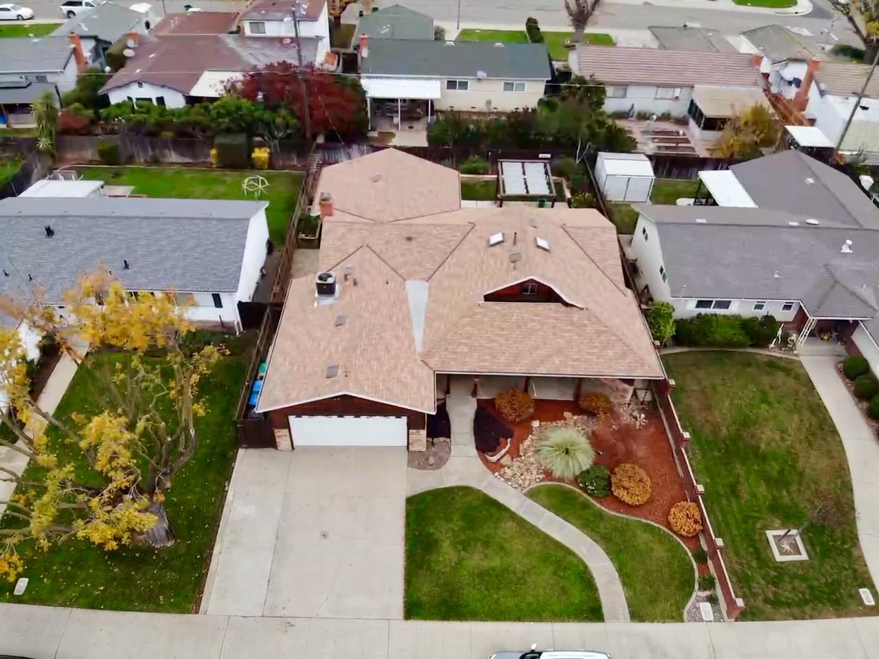 2013 Jerry Lane Lodi, CA 95242 - Photo 8 of 52 an aerial view of a house with a yard and garden