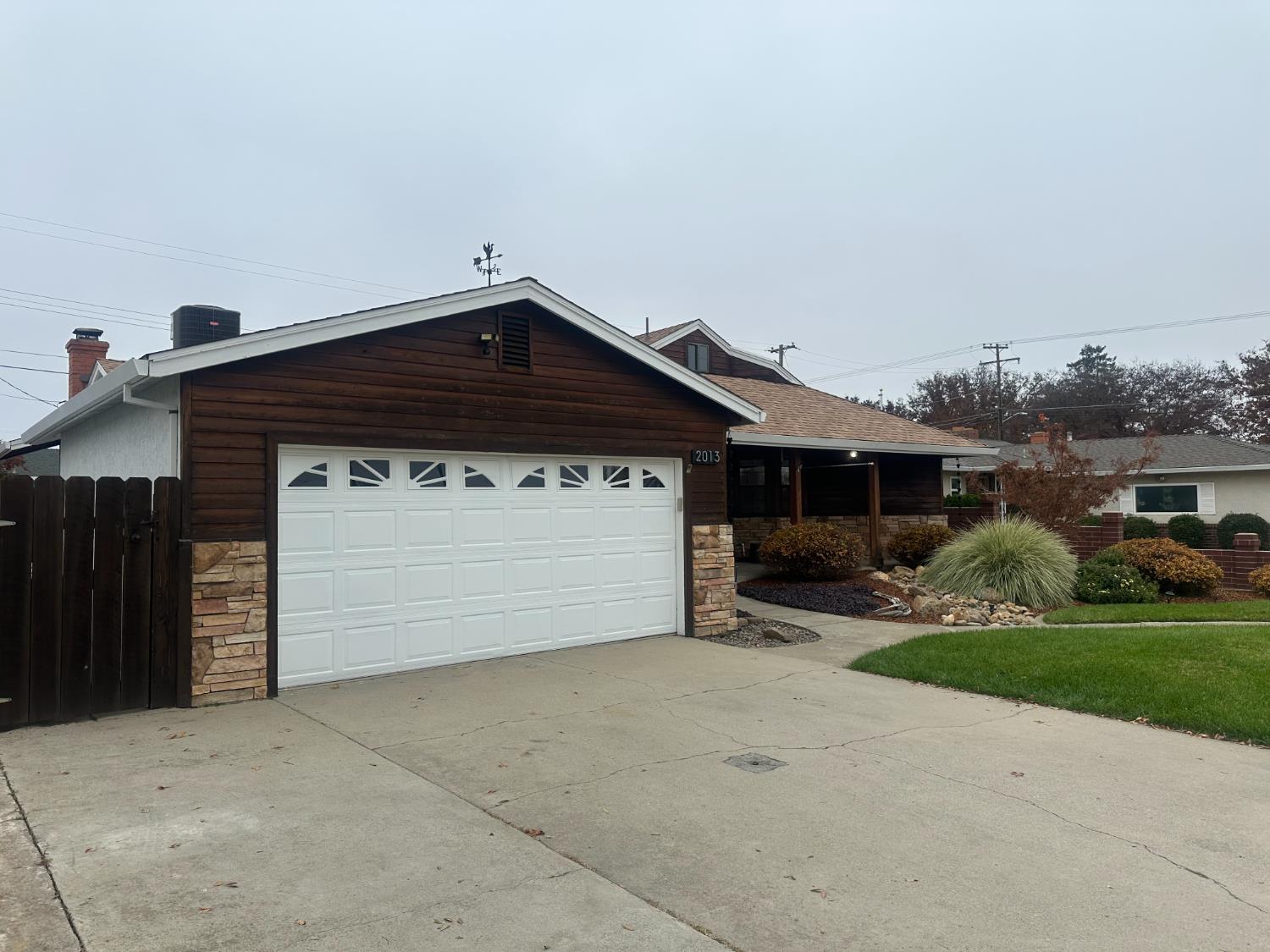 2013 Jerry Lane Lodi, CA 95242 - Photo 10 of 52 a front view of a house with a yard and garage