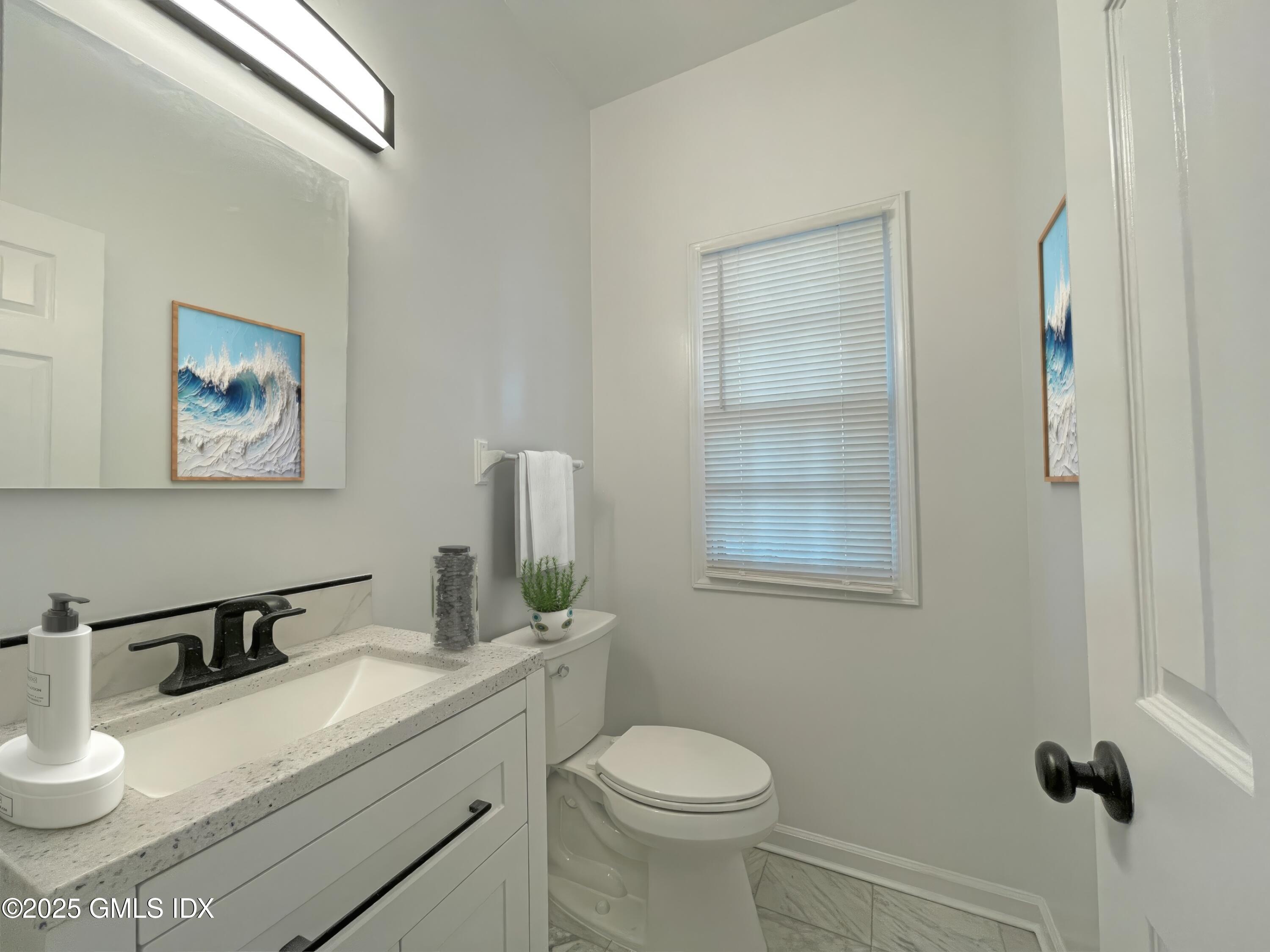 28 Home Place, Unit A2 Greenwich, CT 06830 - Photo 11 of 28 a bathroom with a granite countertop sink mirror vanity and toilet