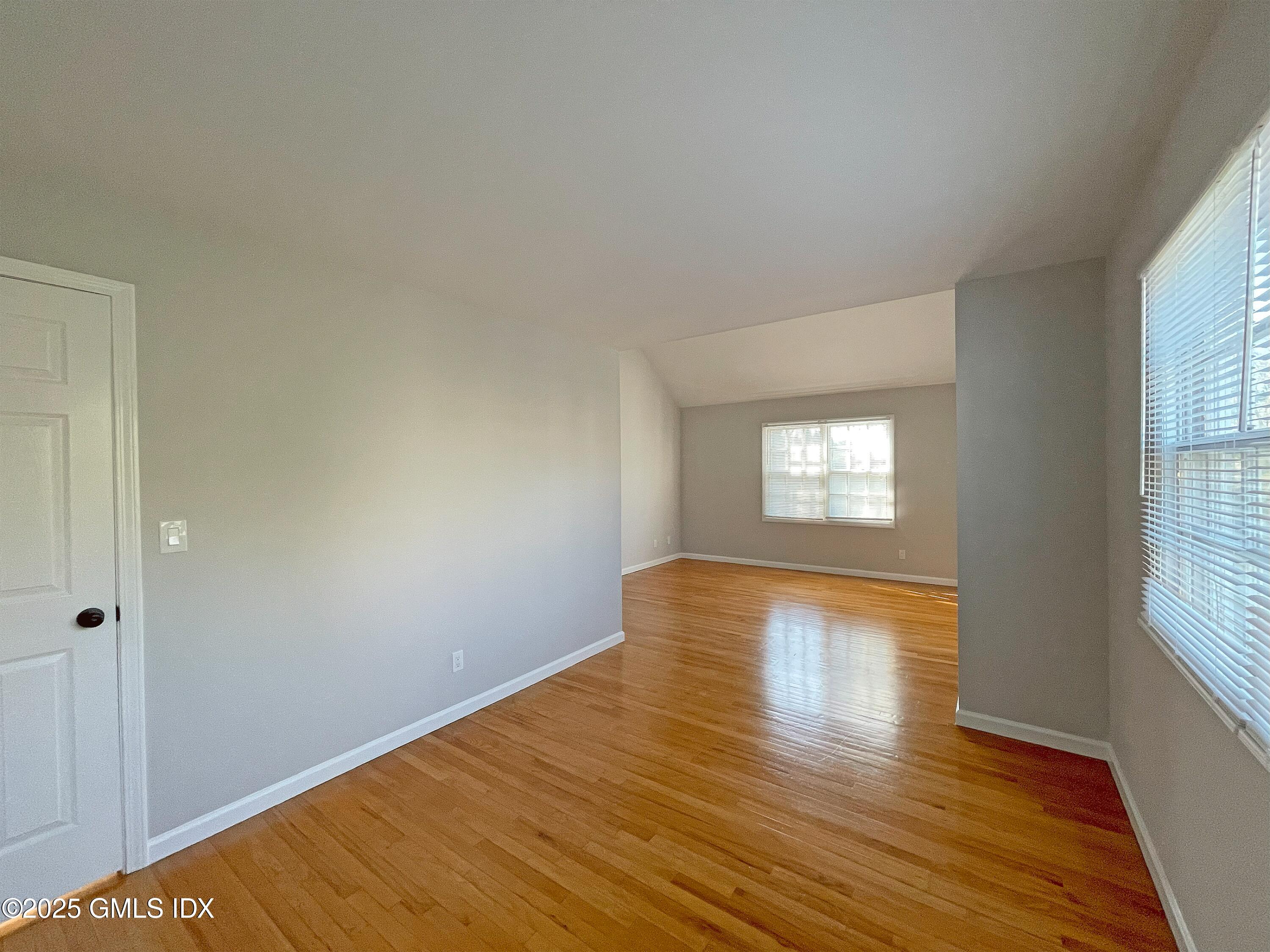 28 Home Place, Unit A2 Greenwich, CT 06830 - Photo 12 of 28 a view of empty room with wooden floor and fan