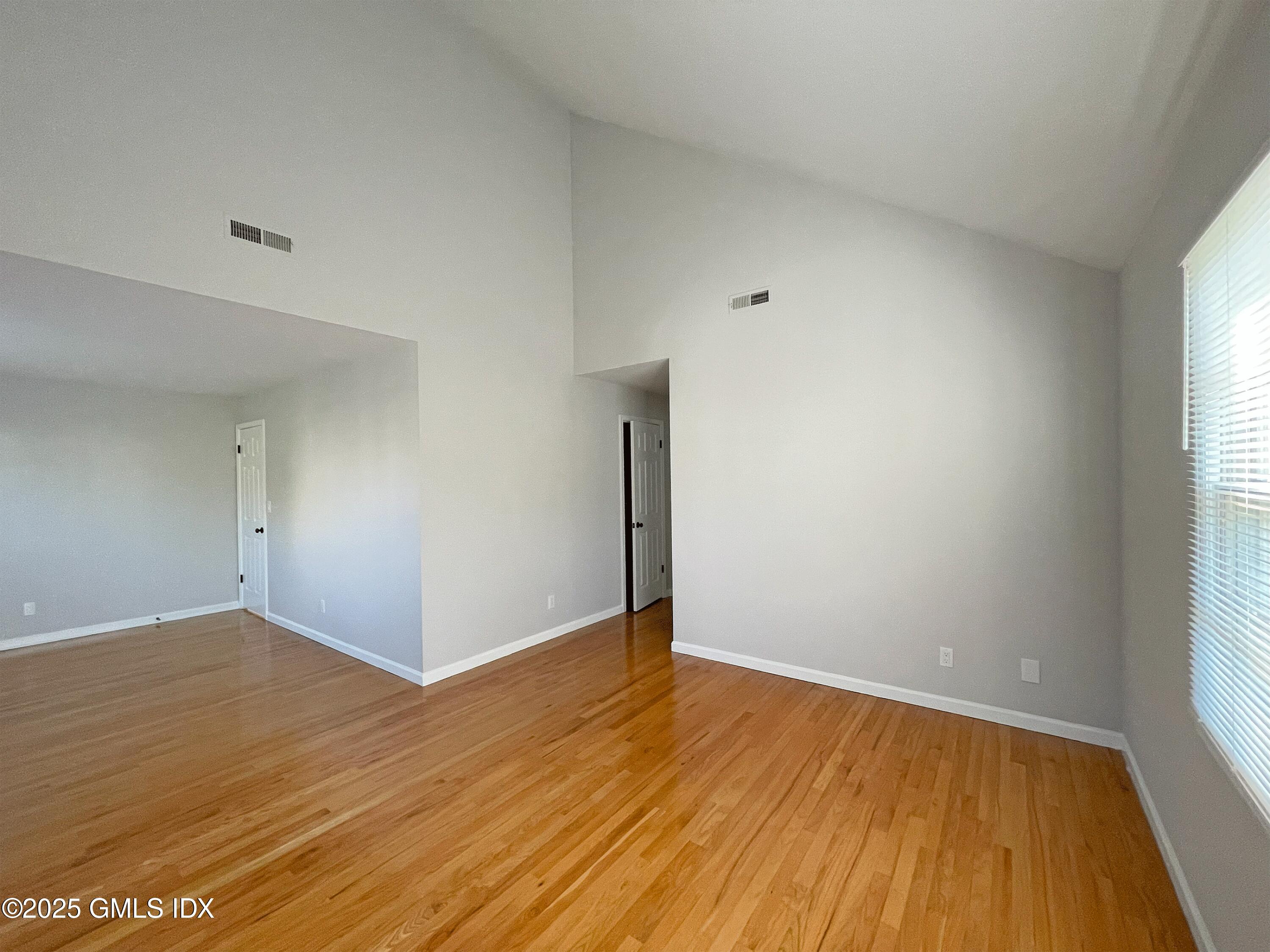 28 Home Place, Unit A2 Greenwich, CT 06830 - Photo 13 of 28 wooden floor in an empty room