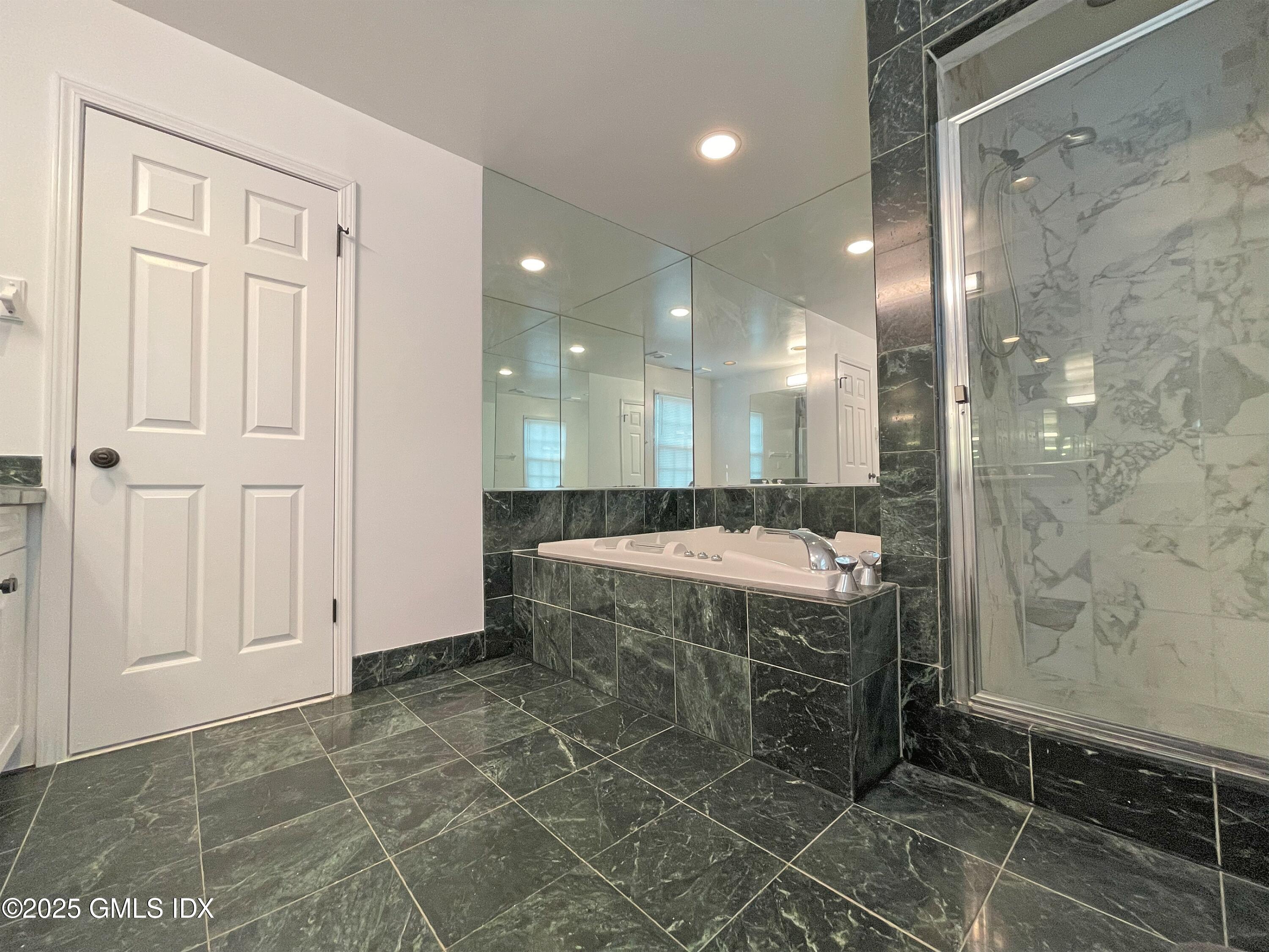 28 Home Place, Unit A2 Greenwich, CT 06830 - Photo 16 of 28 a bathroom with a granite countertop sink a mirror and a shower