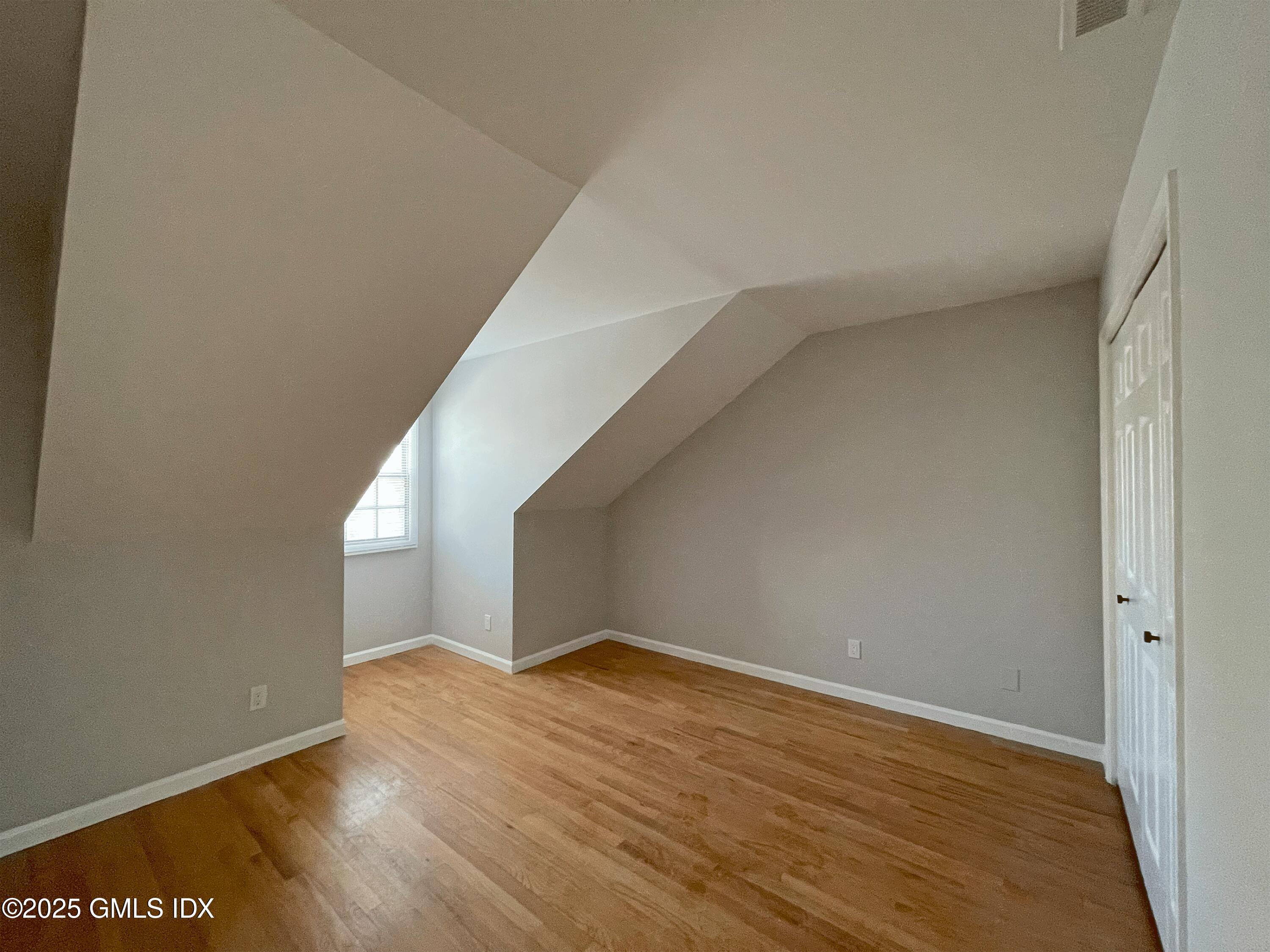28 Home Place, Unit A2 Greenwich, CT 06830 - Photo 19 of 28 a view of empty room with wooden floor