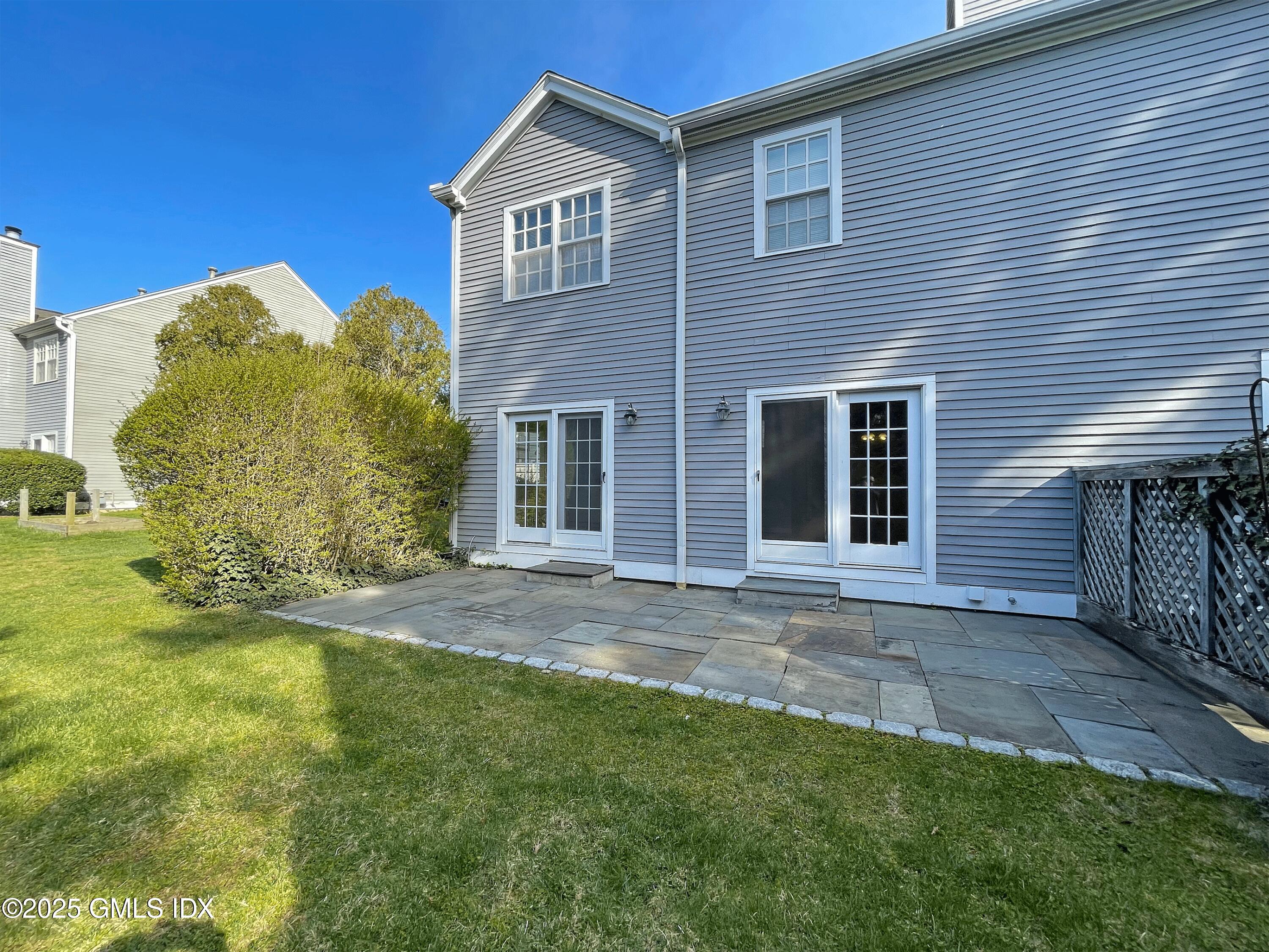 28 Home Place, Unit A2 Greenwich, CT 06830 - Photo 25 of 28 a view of a house with backyard and garden