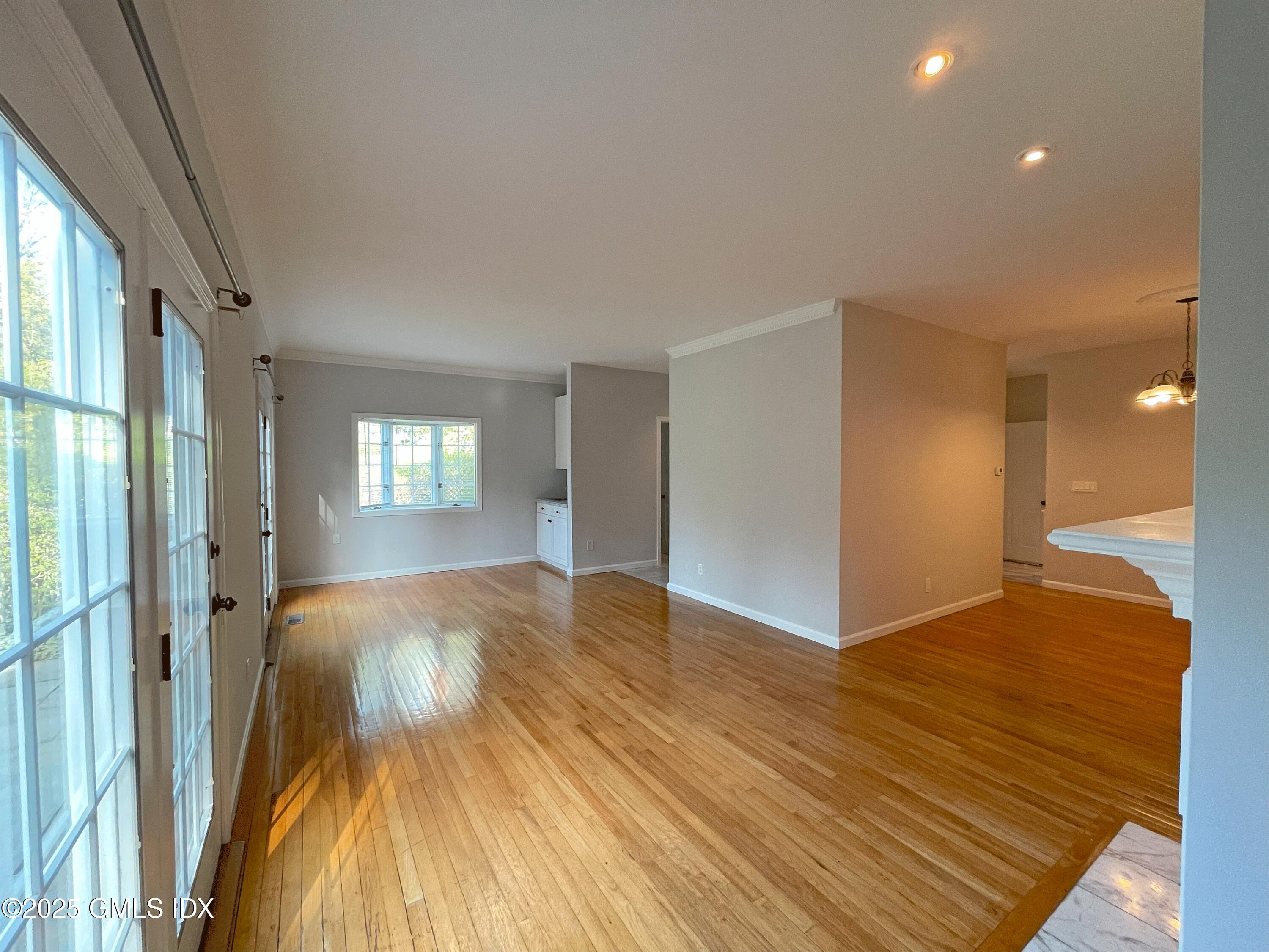 28 Home Place, Unit A2 Greenwich, CT 06830 - Photo 6 of 28 a view of empty room with wooden floor and fan