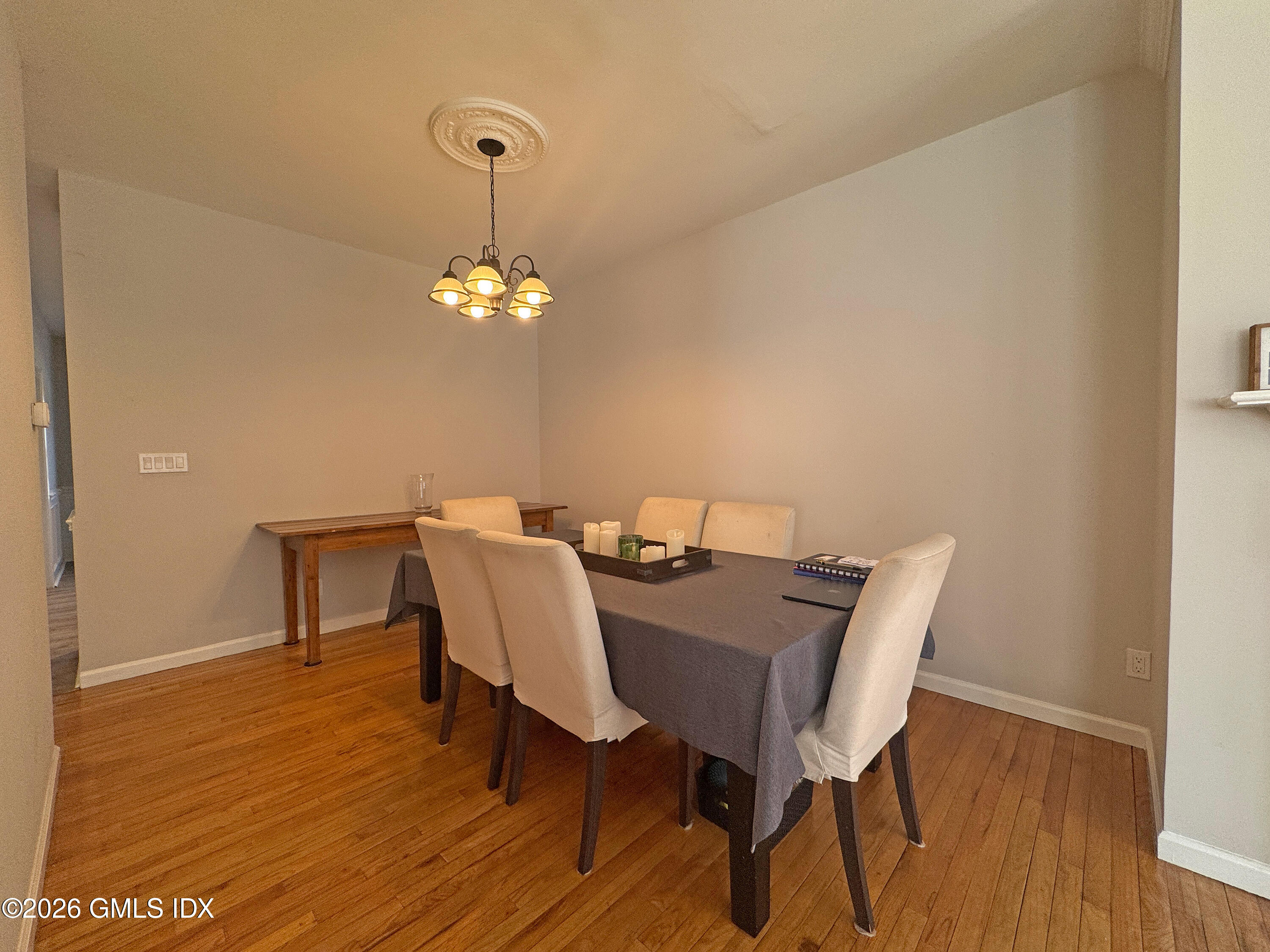 28 Home Place, Unit A2 Greenwich, CT 06830 - Photo 7 of 28 a view of a dining room with furniture and wooden floor