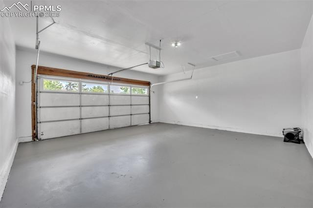 2004 Monterey Road Colorado Springs, CO 80910 - Photo 19 of 27 Garage featuring a garage door opener