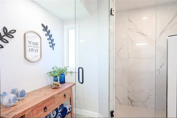 a bathroom with a double vanity sink and mirror