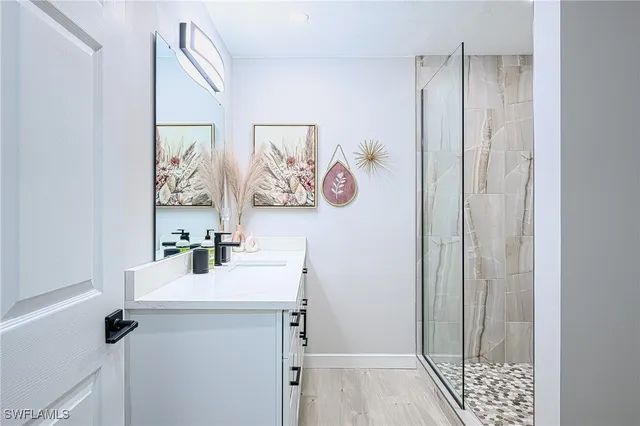 a bathroom with a sink and a mirror