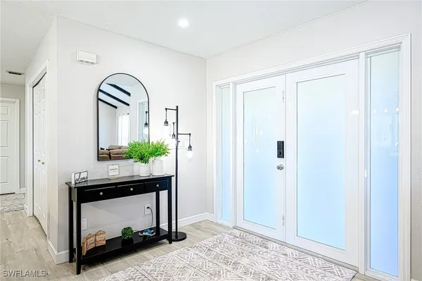 a view of hall way with mirror