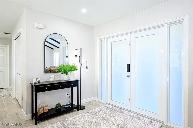 a view of hall way with mirror