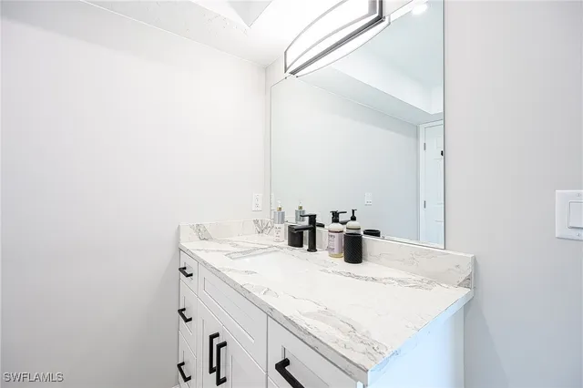 a view of a patio with a table and chairs