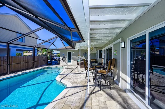 a view of a backyard with sitting area
