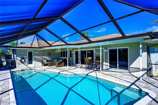 a view of an chairs and table in the patio
