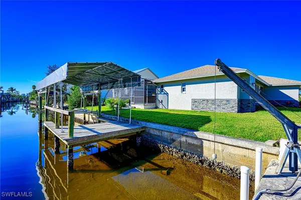 a view of a chairs and table in the balcony