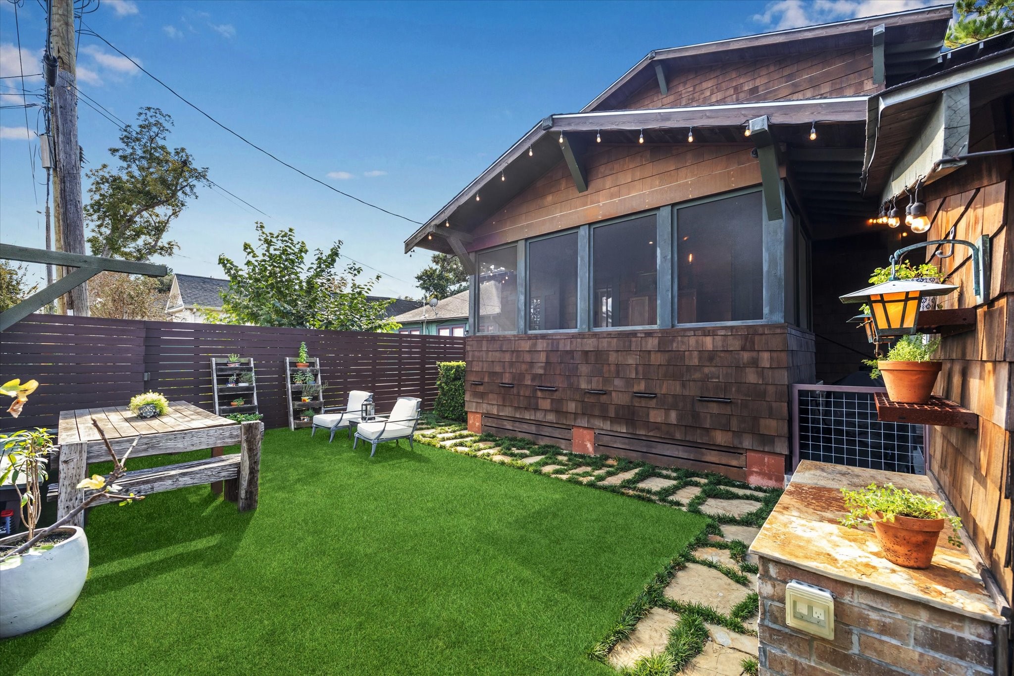 512 Archer Street Houston, TX 77009 - Photo 7 of 40 Enjoy year-round outdoor living in the low-maintenance, turfed backyard, complete with landscape lighting.