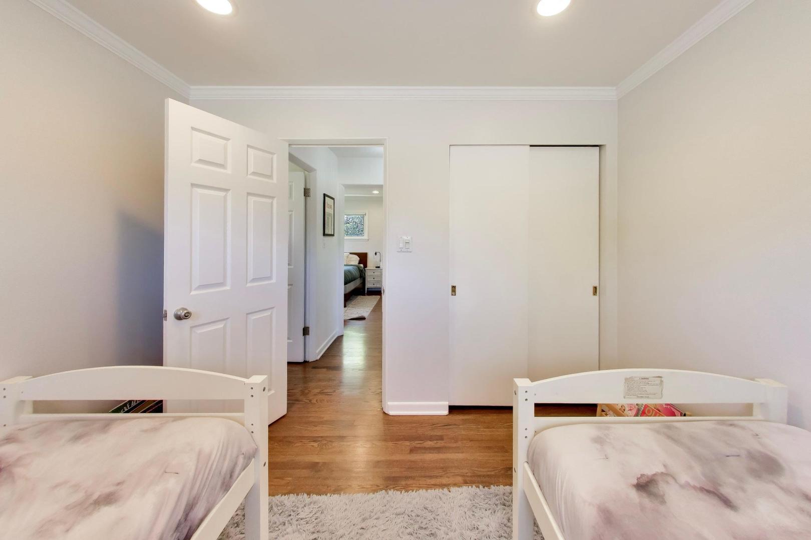 1153 Kenton Road Deerfield, IL 60015 - Photo 20 of 40 a bedroom with a bed and wooden floor