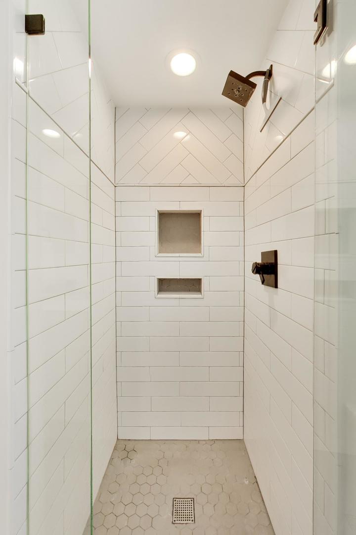 1153 Kenton Road Deerfield, IL 60015 - Photo 28 of 40 a bathroom with a shower
