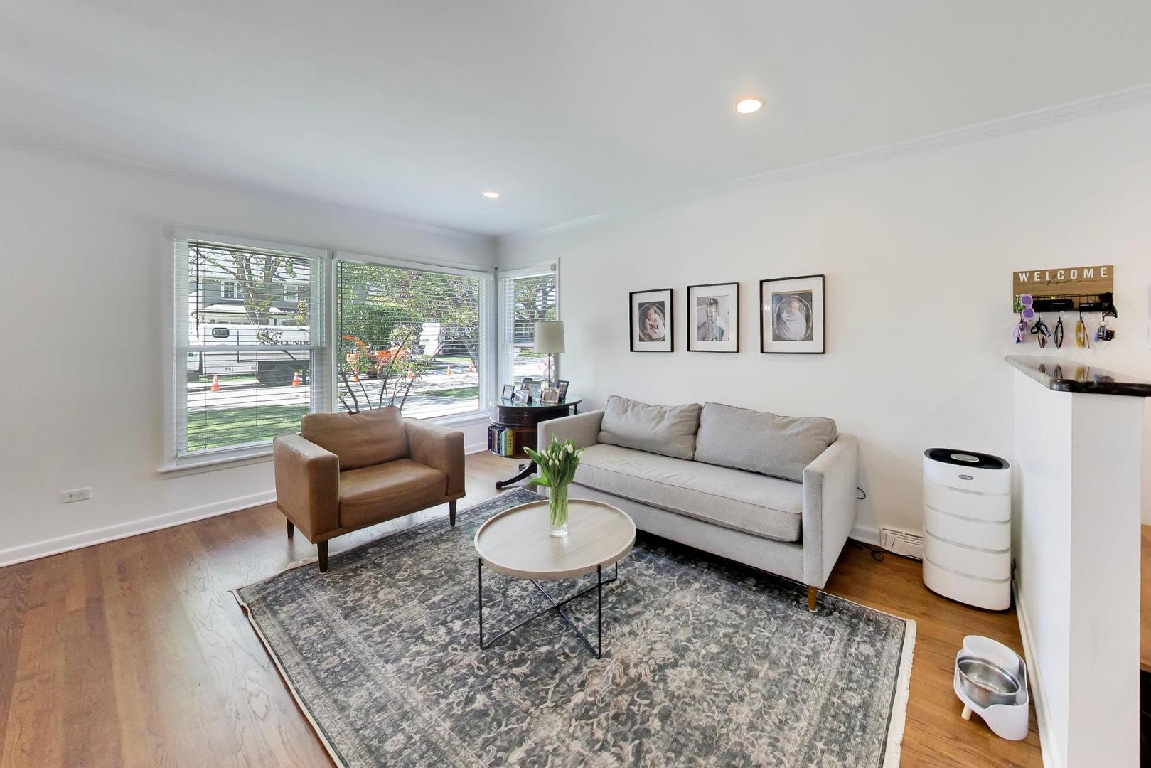 1153 Kenton Road Deerfield, IL 60015 - Photo 5 of 40 a living room with furniture and a rug