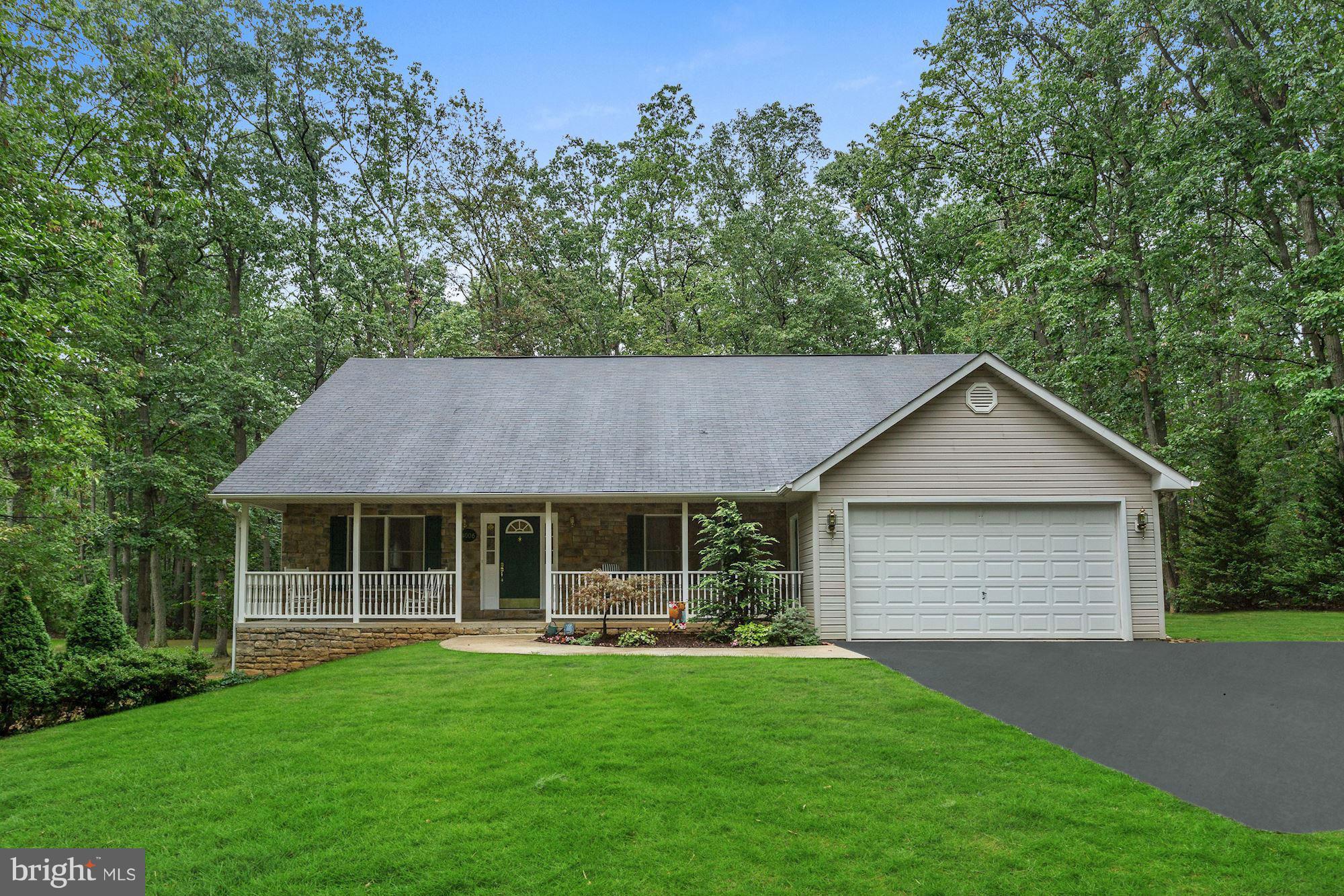 4006 Roop Road New Windsor, MD 21776 - Photo 1 of 22 a house view with a garden space