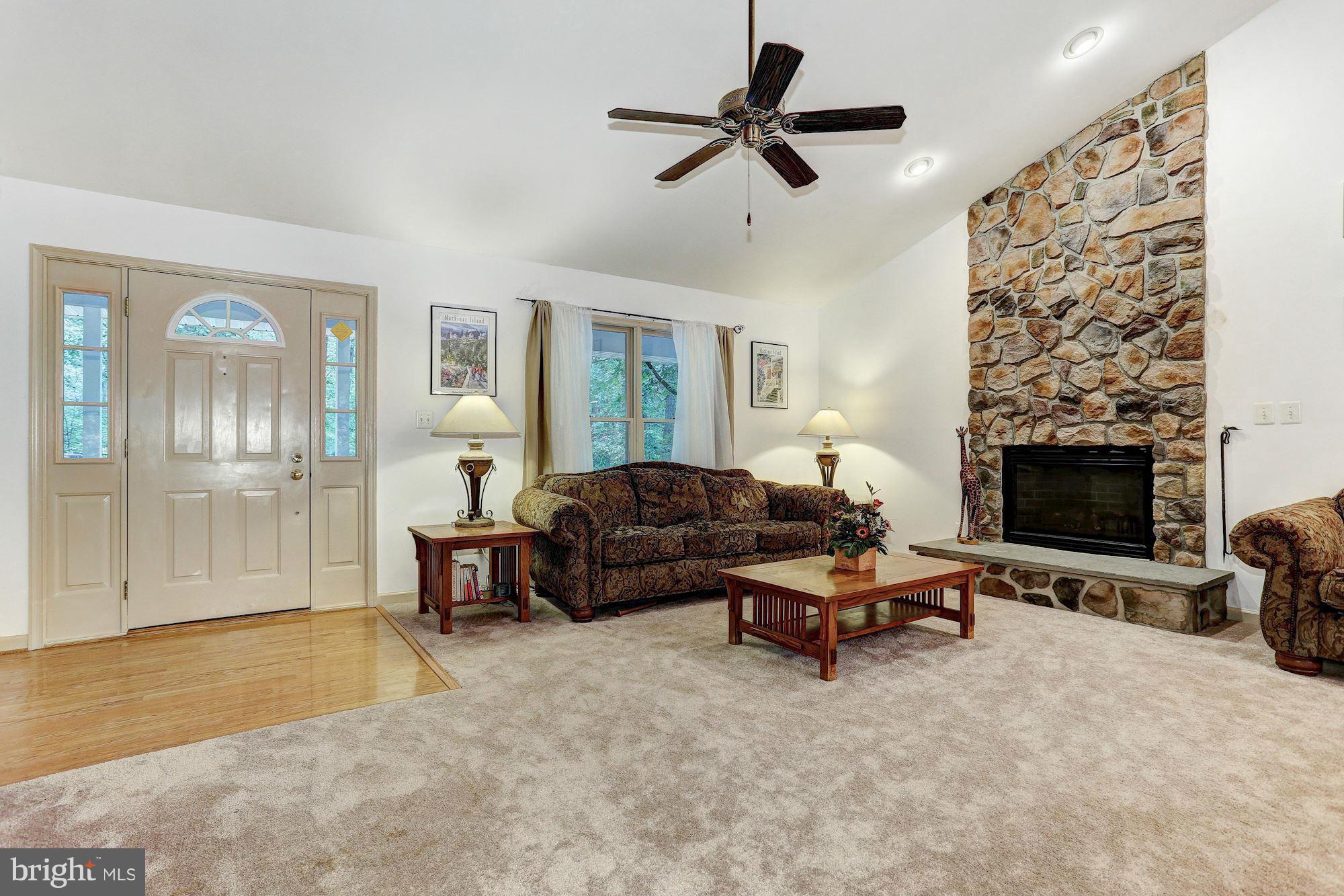4006 Roop Road New Windsor, MD 21776 - Photo 2 of 22 a living room with furniture and a fireplace