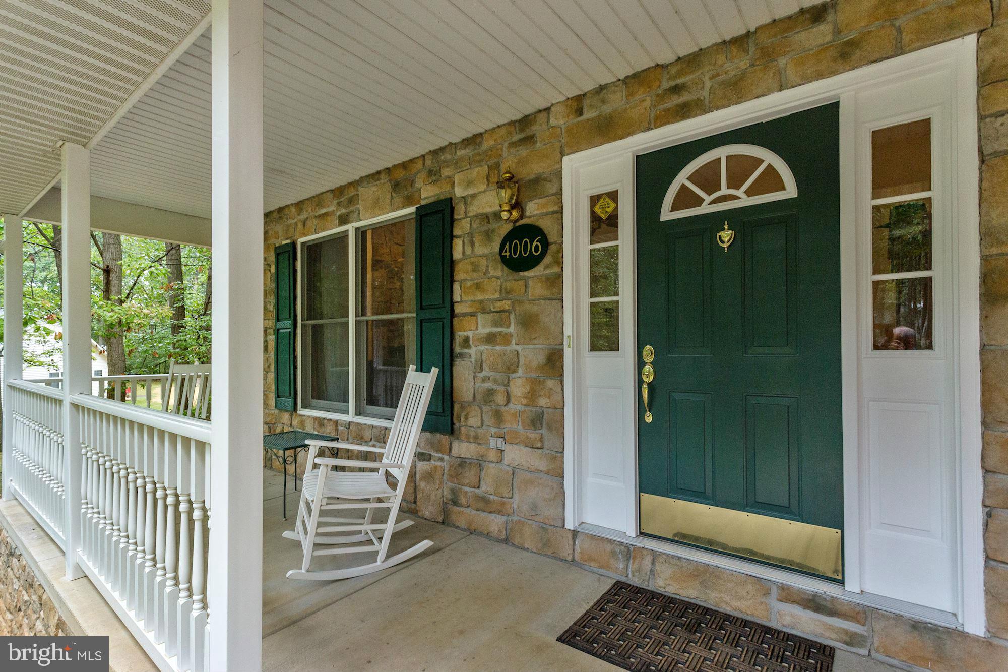 4006 Roop Road New Windsor, MD 21776 - Photo 20 of 22 a front view of a house with a glass door