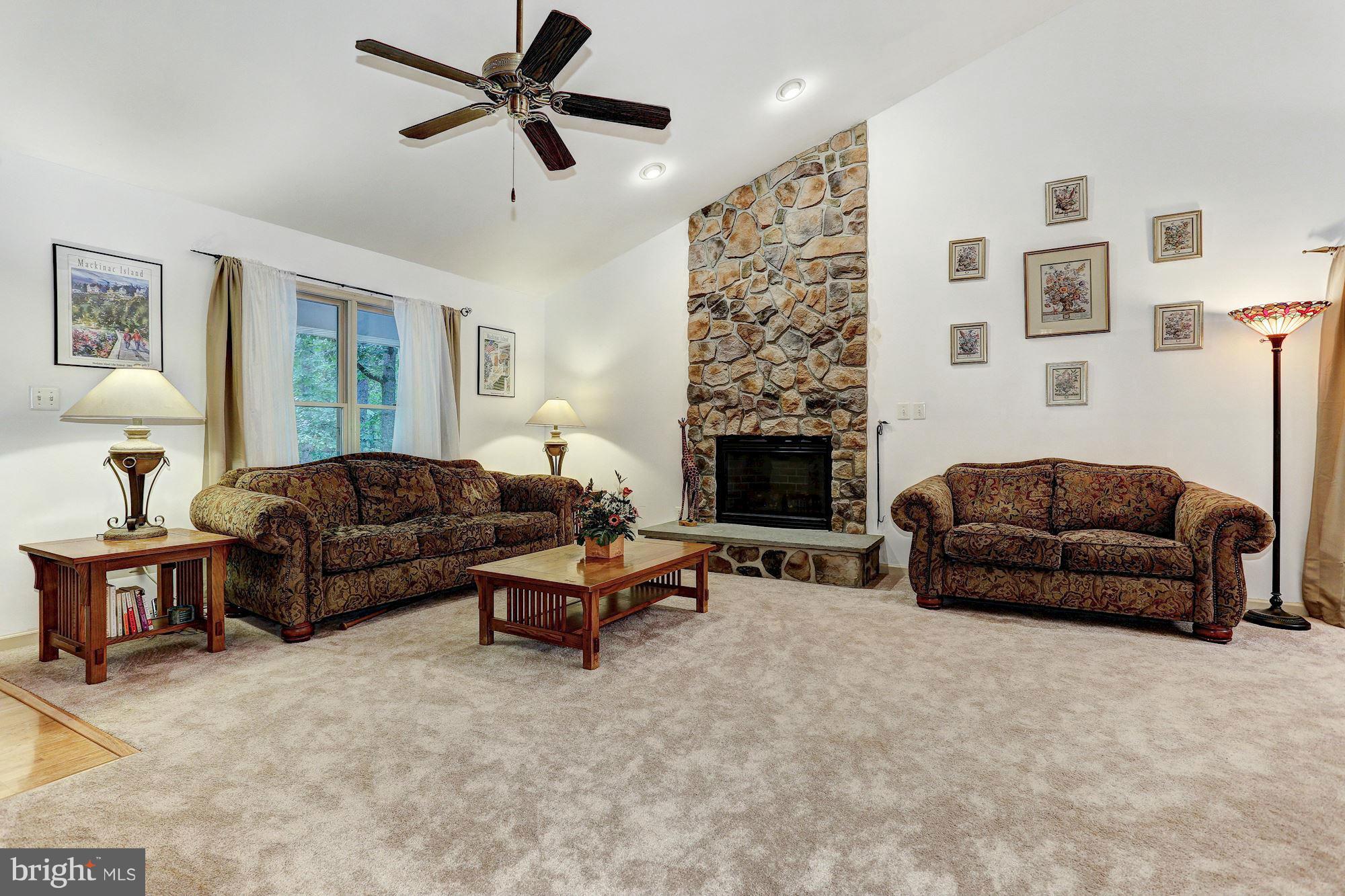 4006 Roop Road New Windsor, MD 21776 - Photo 3 of 22 a living room with furniture and a fireplace