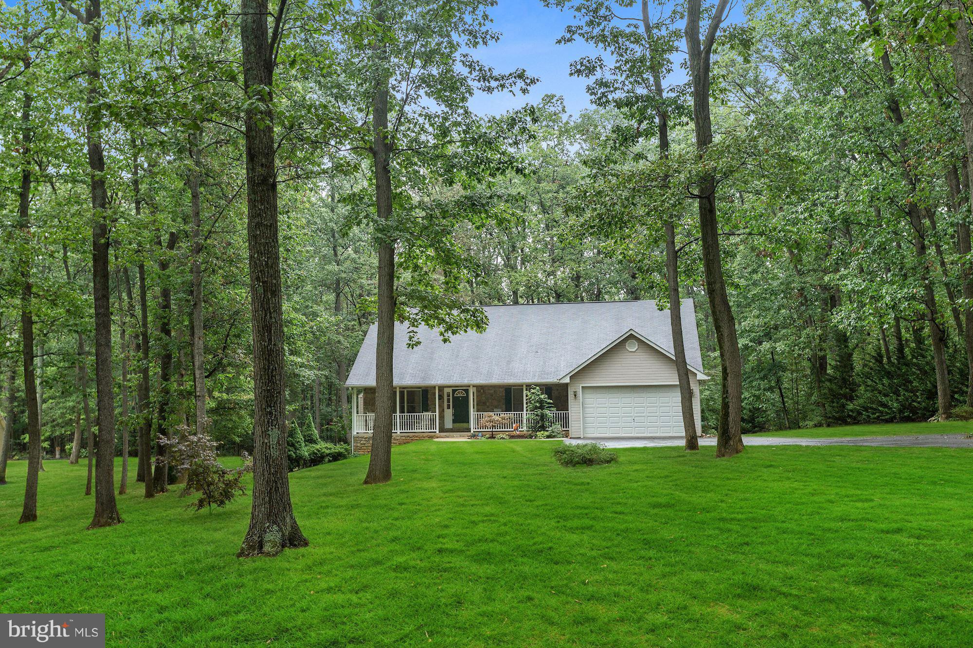 4006 Roop Road New Windsor, MD 21776 - Photo 22 of 22 a front view of a house with a yard and green space