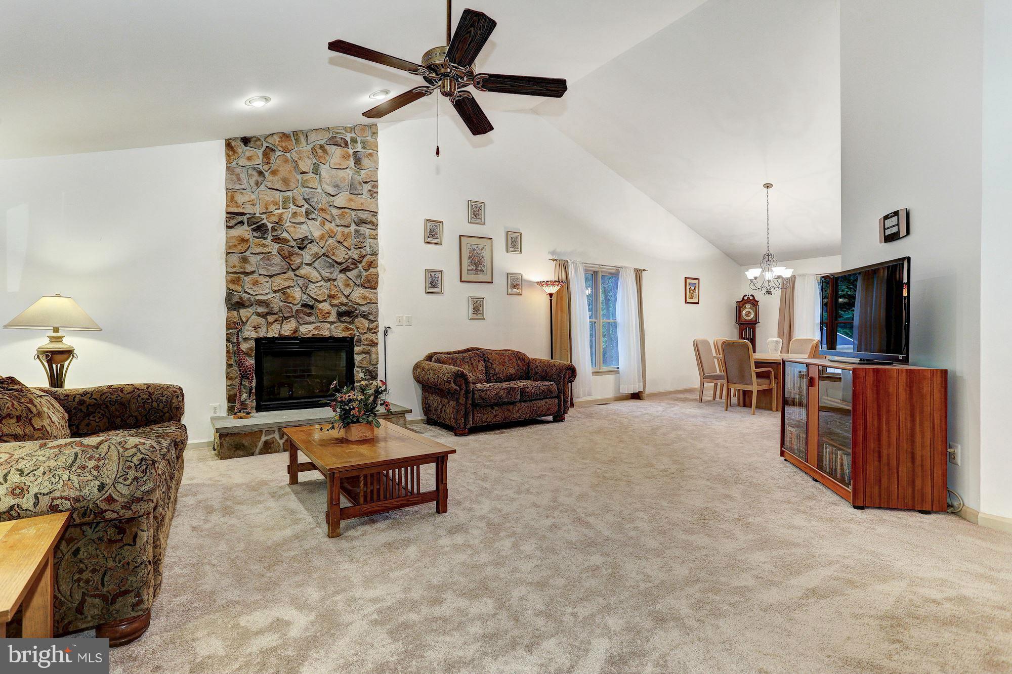 4006 Roop Road New Windsor, MD 21776 - Photo 4 of 22 a living room with furniture and a fireplace