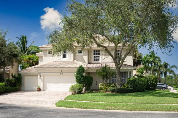 a utility room with sink dryer and washer