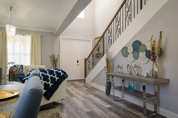 a bedroom with a bed and a painting on the wall