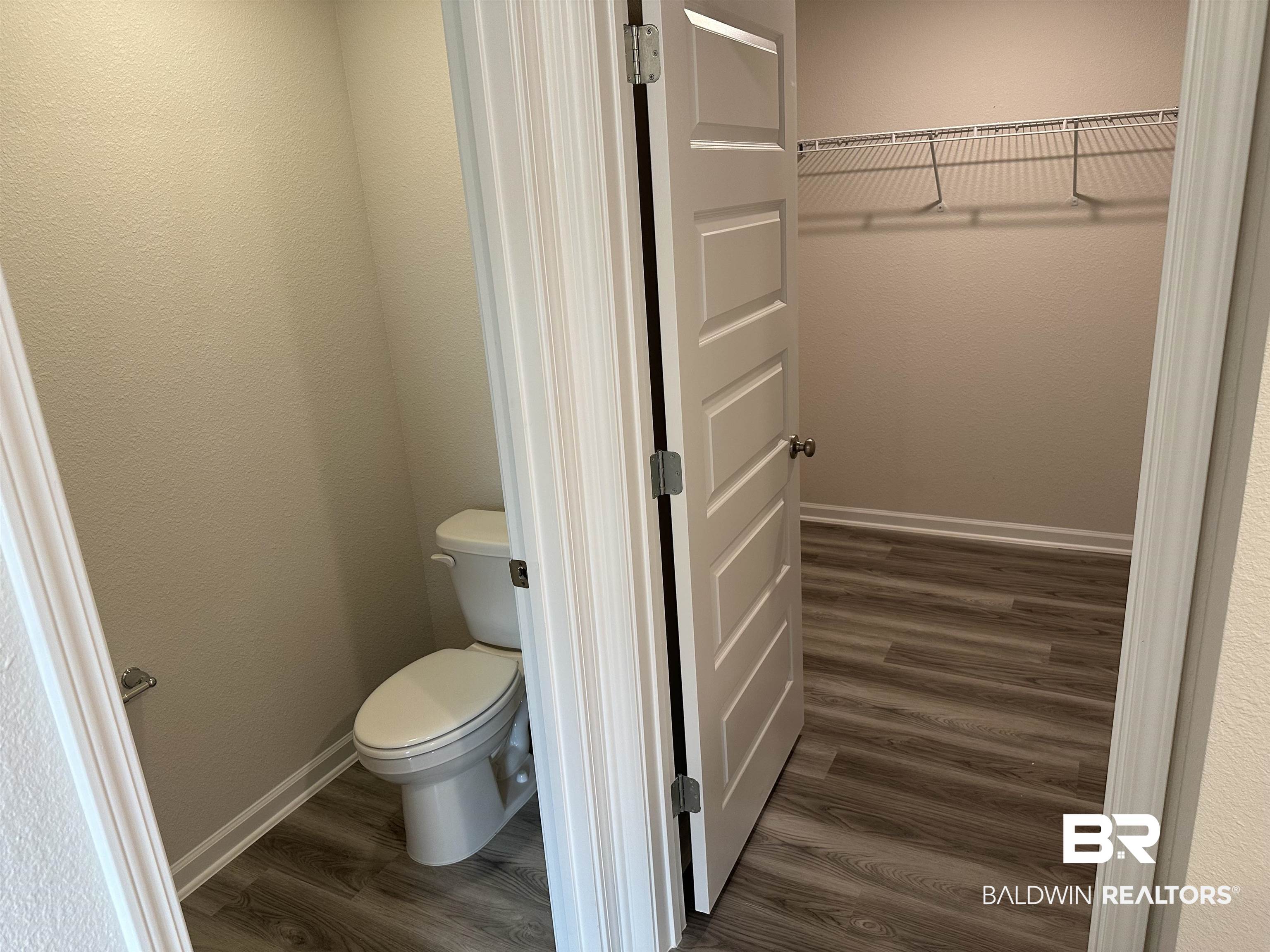 1238 Hayward Loop Foley, AL 36535 - Photo 34 of 46 Bathroom featuring toilet and wood-type flooring