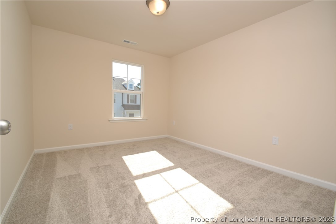 5703 Preveza Place Raleigh, NC 27603 - Photo 20 of 33 an empty room with windows