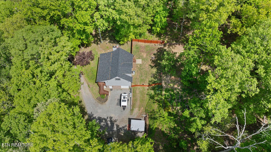 8908 Ellis Lane Powell, TN 37849 - Photo 36 of 37 an aerial view of a house with outdoor space and trees all around