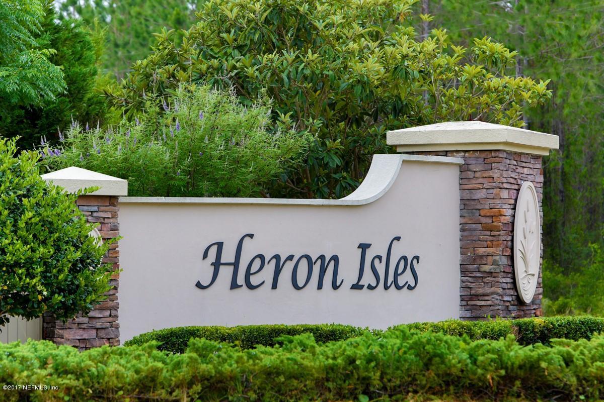 97499 Albatross Drive Yulee, FL 32097 - Photo 4 of 5 Heron Isles Entrance sign