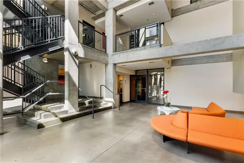a view of a balcony with wooden floor and stairs