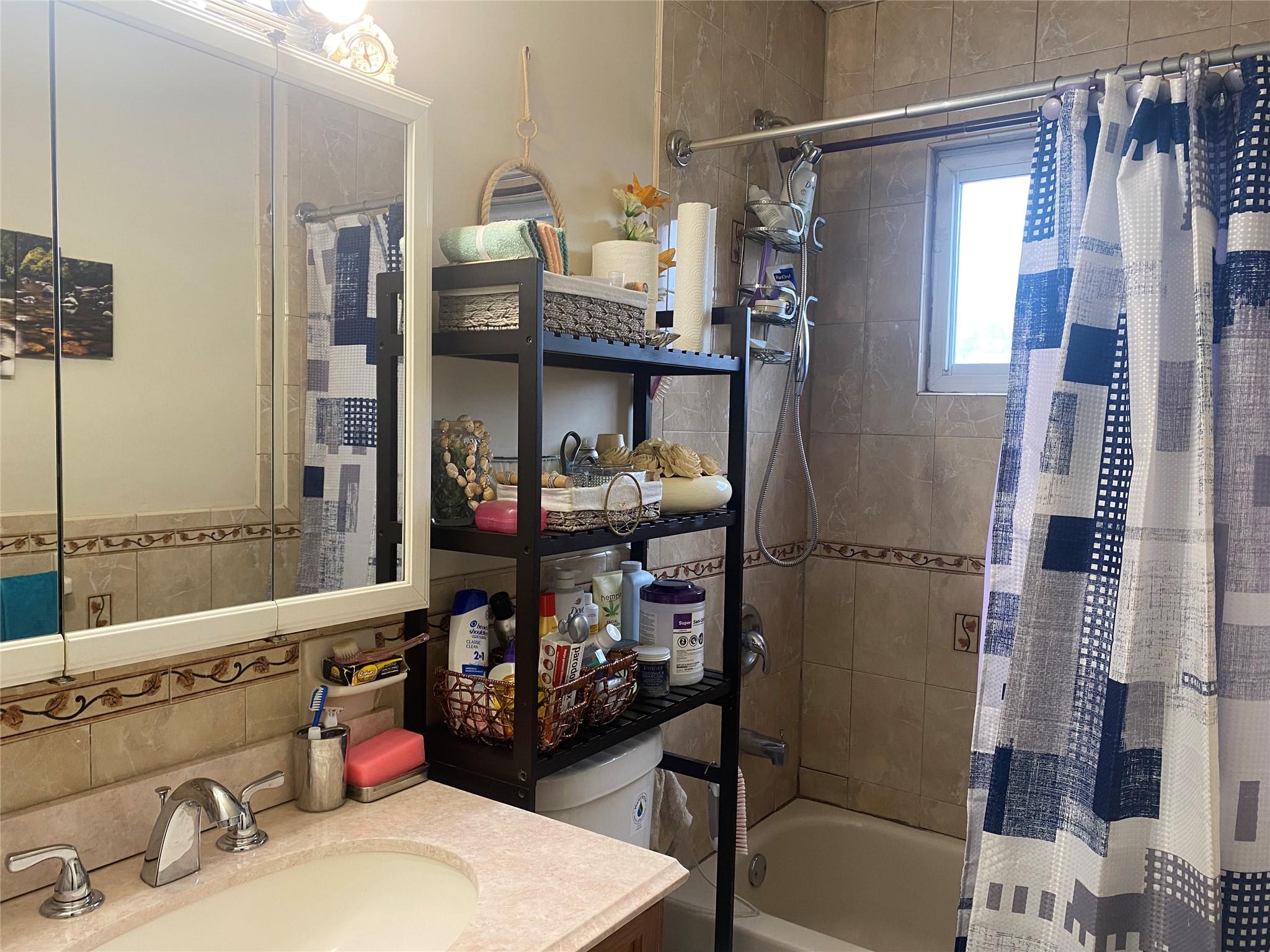 106-60 Ditmars Boulevard Queens, NY 11369 - Photo 12 of 12 a kitchen with a refrigerator and a sink